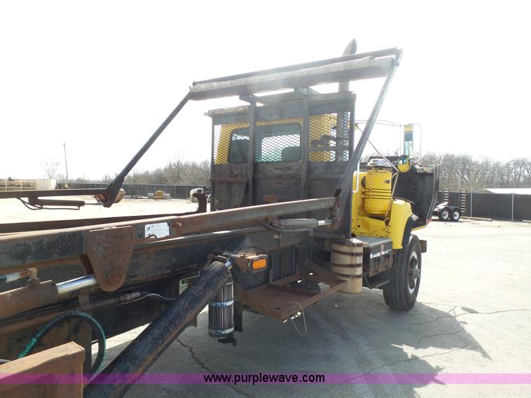 image for item L3209 1988 Mack DM690S roll off truck