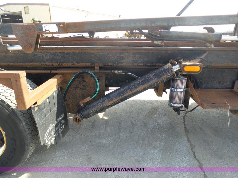 image for item L3209 1988 Mack DM690S roll off truck