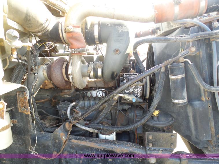 image for item L3209 1988 Mack DM690S roll off truck