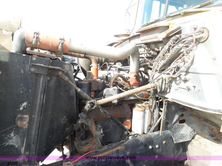 image for item L3209 1988 Mack DM690S roll off truck