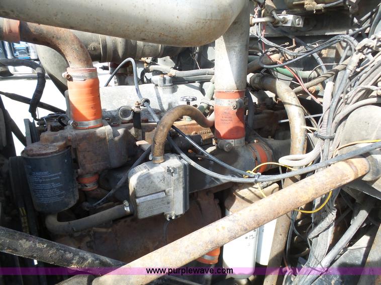 image for item L3209 1988 Mack DM690S roll off truck