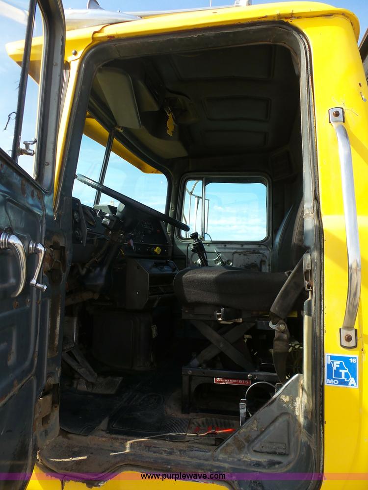 image for item L3209 1988 Mack DM690S roll off truck