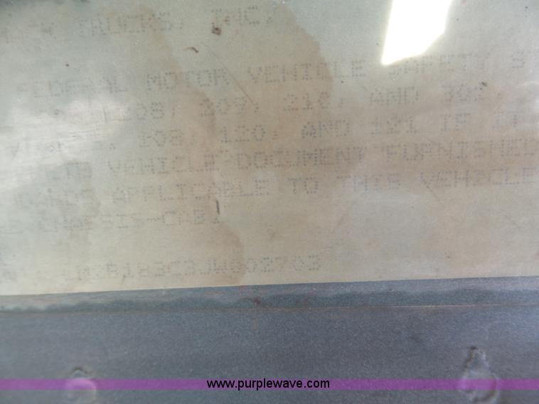 image for item L3209 1988 Mack DM690S roll off truck