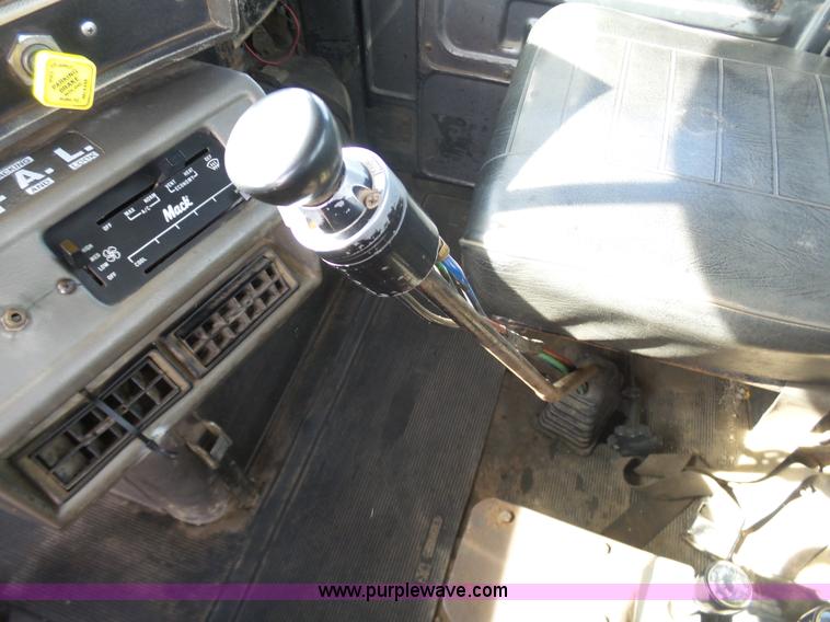 image for item L3209 1988 Mack DM690S roll off truck