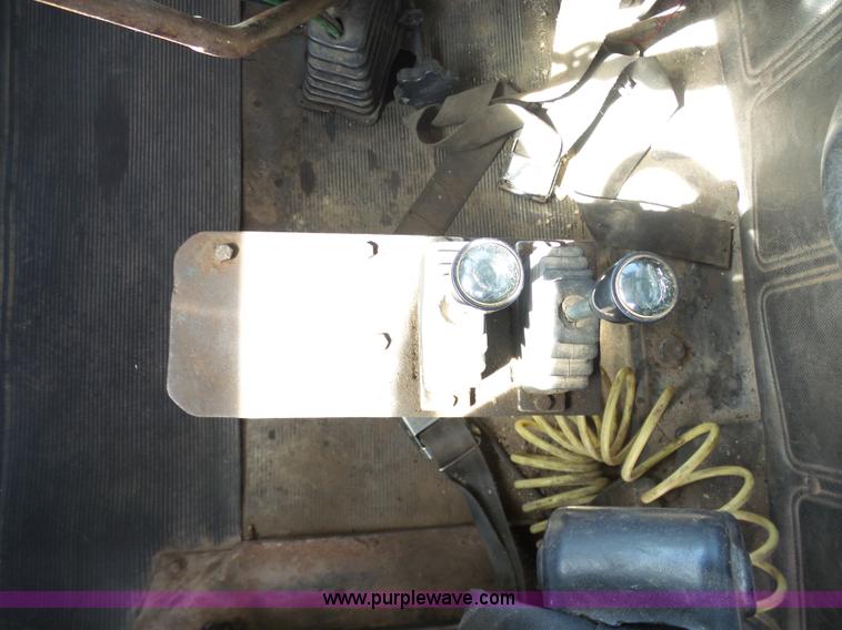 image for item L3209 1988 Mack DM690S roll off truck