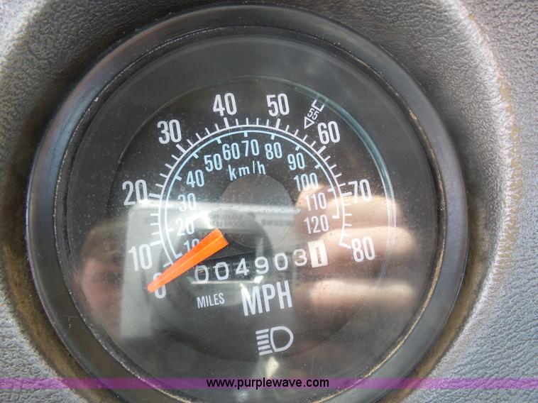 image for item L3209 1988 Mack DM690S roll off truck