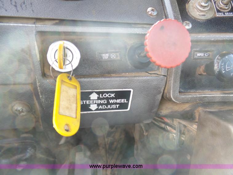 image for item L3209 1988 Mack DM690S roll off truck