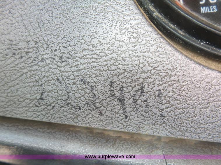 image for item L3209 1988 Mack DM690S roll off truck