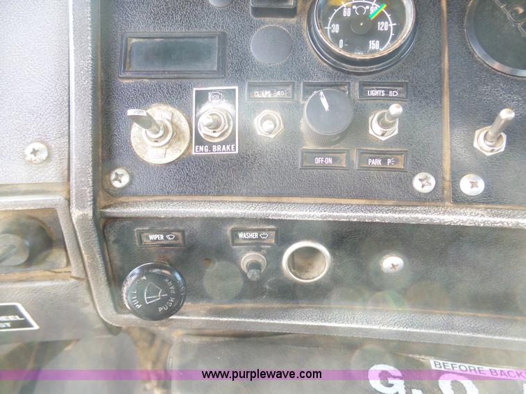 image for item L3209 1988 Mack DM690S roll off truck