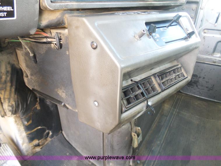 image for item L3209 1988 Mack DM690S roll off truck