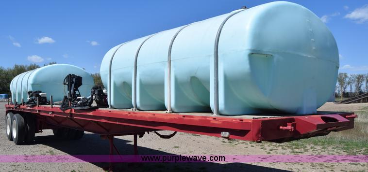 image for item BX9963 1980 Hobb flatbed trailer with poly tanks