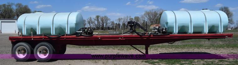 image for item BX9963 1980 Hobb flatbed trailer with poly tanks