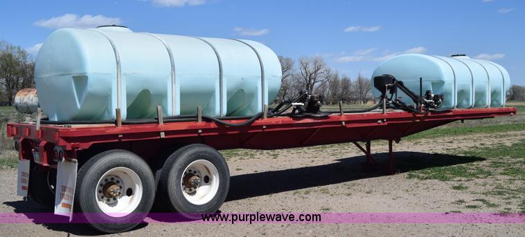image for item BX9963 1980 Hobb flatbed trailer with poly tanks