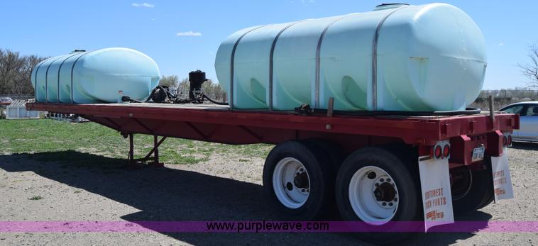 image for item BX9963 1980 Hobb flatbed trailer with poly tanks