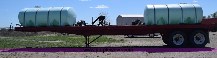 image for item BX9963 1980 Hobb flatbed trailer with poly tanks