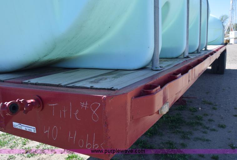 image for item BX9963 1980 Hobb flatbed trailer with poly tanks