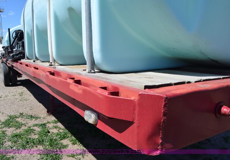 image for item BX9963 1980 Hobb flatbed trailer with poly tanks