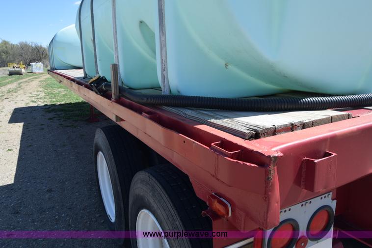 image for item BX9963 1980 Hobb flatbed trailer with poly tanks