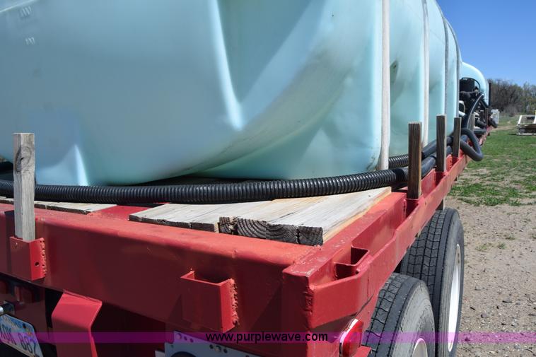 image for item BX9963 1980 Hobb flatbed trailer with poly tanks