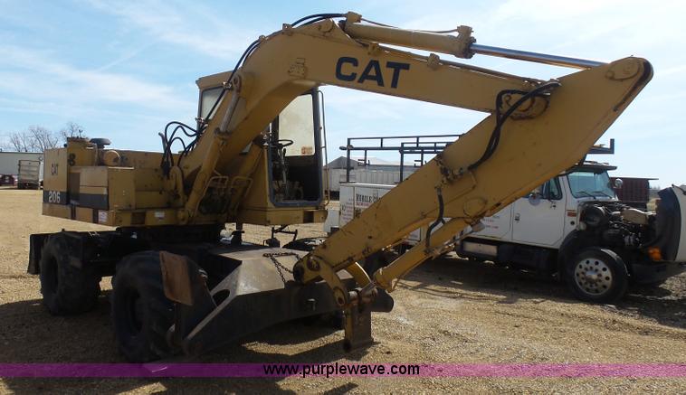 image for item J1675 1986 Caterpillar 206 rubber tire excavator