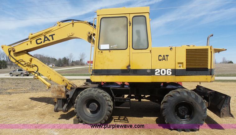 image for item J1675 1986 Caterpillar 206 rubber tire excavator