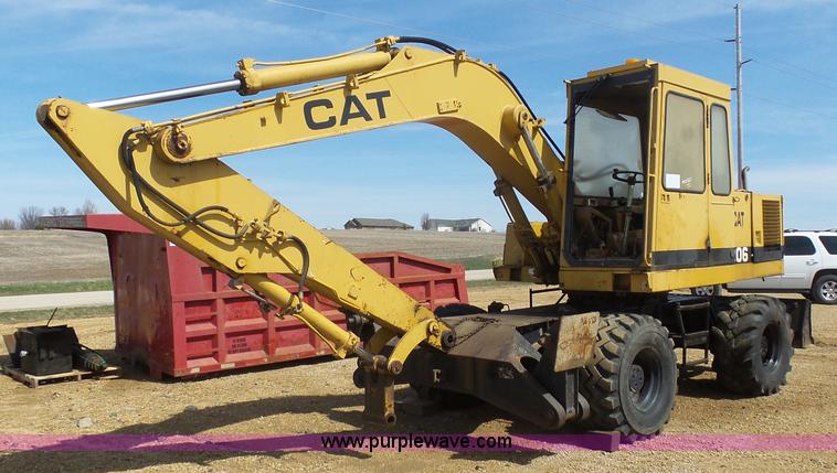 image for item J1675 1986 Caterpillar 206 rubber tire excavator