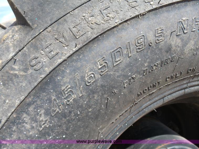 image for item J1675 1986 Caterpillar 206 rubber tire excavator