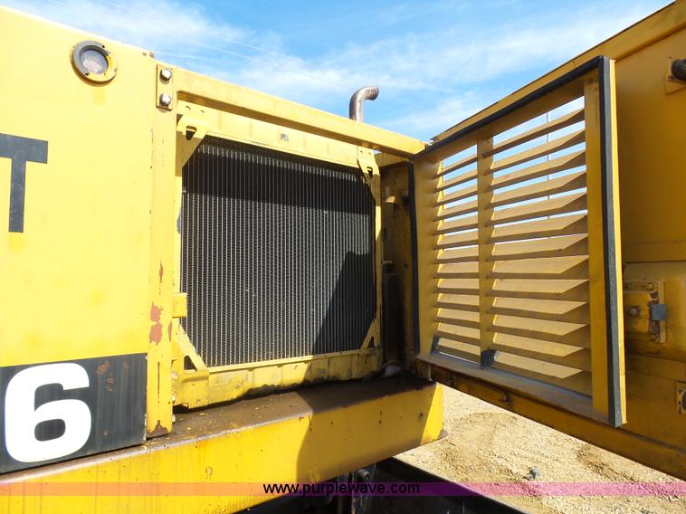 image for item J1675 1986 Caterpillar 206 rubber tire excavator