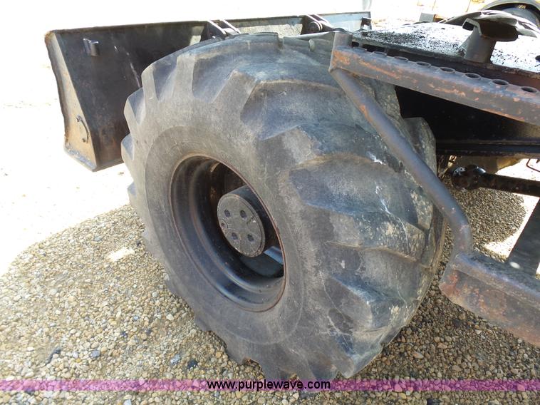 image for item J1675 1986 Caterpillar 206 rubber tire excavator