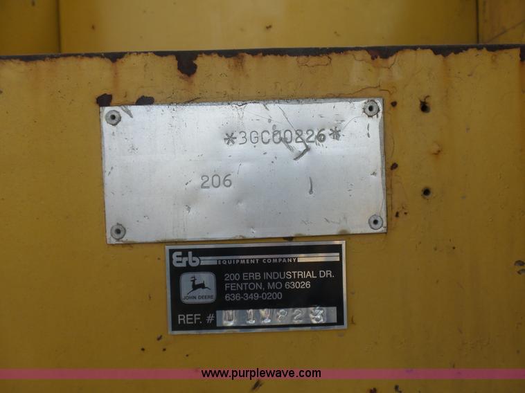 image for item J1675 1986 Caterpillar 206 rubber tire excavator