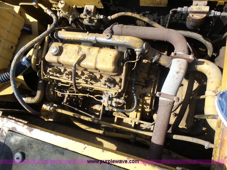 image for item J1675 1986 Caterpillar 206 rubber tire excavator