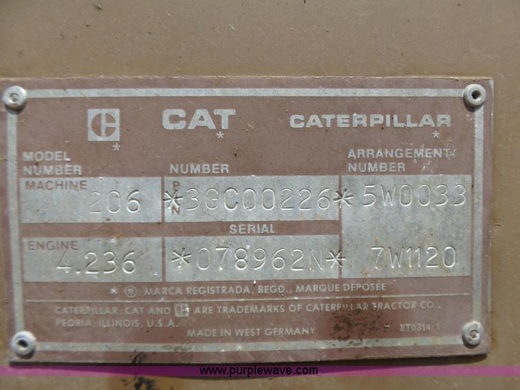 image for item J1675 1986 Caterpillar 206 rubber tire excavator