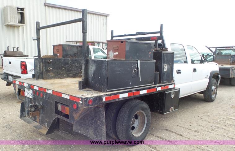 image for item L2186 2006 Chevrolet Silverado 3500 Crew Cab flatbed pickup truck