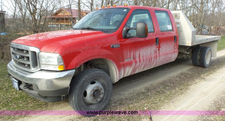 image for item L5659 2004 Ford F550 Super Duty XLT Crew cab flatbed pickup truck