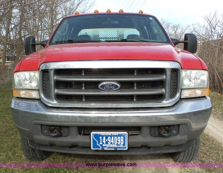 image for item L5659 2004 Ford F550 Super Duty XLT Crew cab flatbed pickup truck