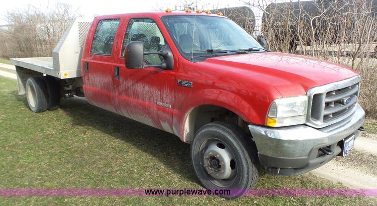 image for item L5659 2004 Ford F550 Super Duty XLT Crew cab flatbed pickup truck