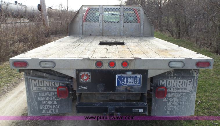 image for item L5659 2004 Ford F550 Super Duty XLT Crew cab flatbed pickup truck