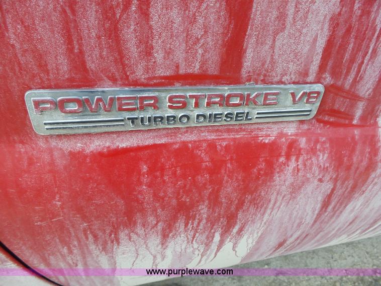 image for item L5659 2004 Ford F550 Super Duty XLT Crew cab flatbed pickup truck