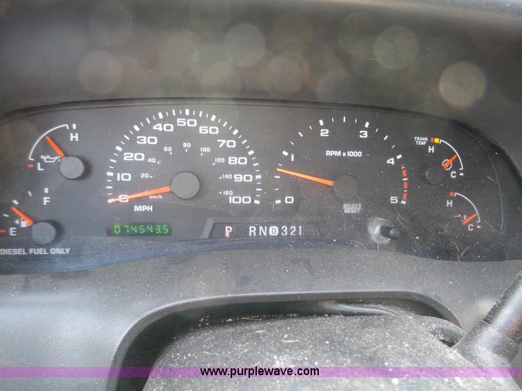 image for item L5659 2004 Ford F550 Super Duty XLT Crew cab flatbed pickup truck