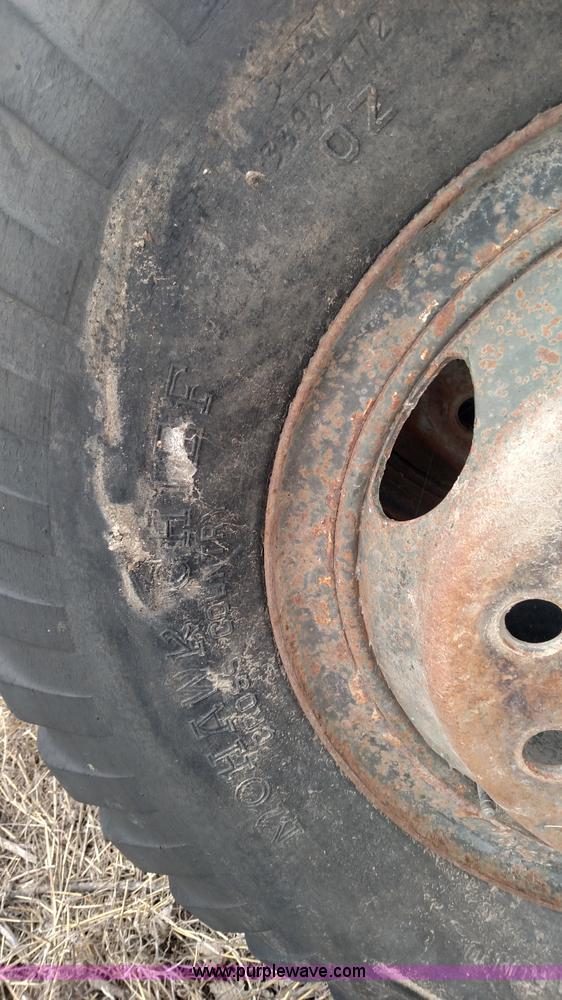 image for item L7449 (8) 11.00-20 tires and wheels