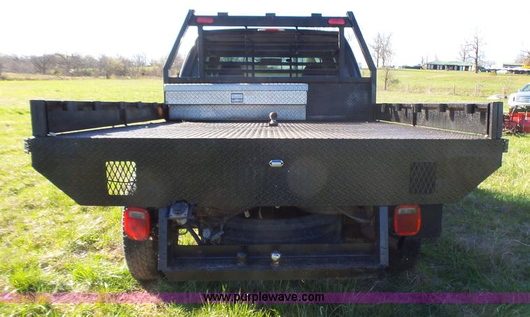 image for item BG9084 2000 Ford F250 Super Duty SuperCab flatbed pickup truck
