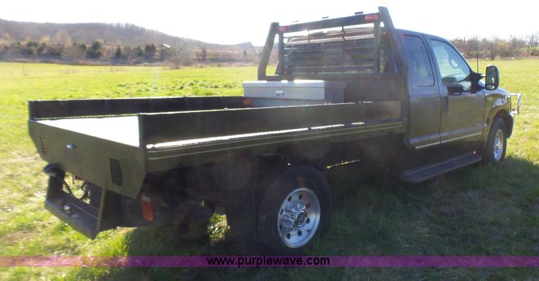 image for item BG9084 2000 Ford F250 Super Duty SuperCab flatbed pickup truck