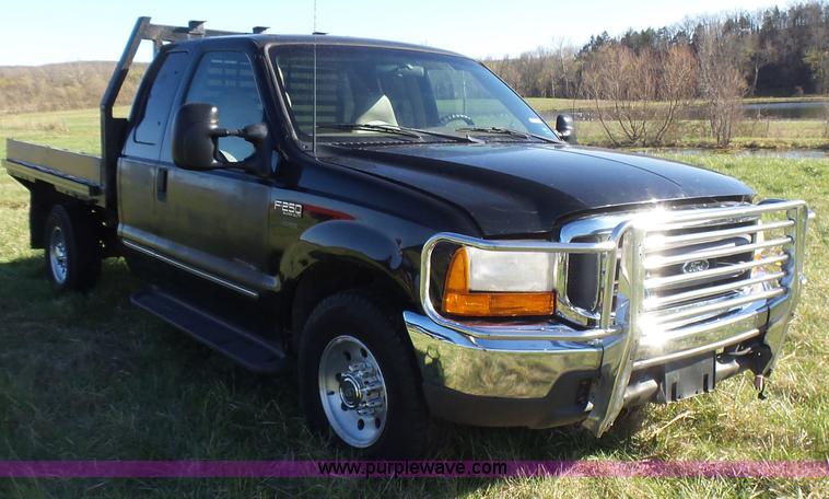 image for item BG9084 2000 Ford F250 Super Duty SuperCab flatbed pickup truck