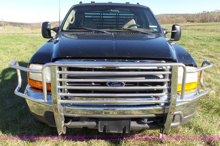 image for item BG9084 2000 Ford F250 Super Duty SuperCab flatbed pickup truck