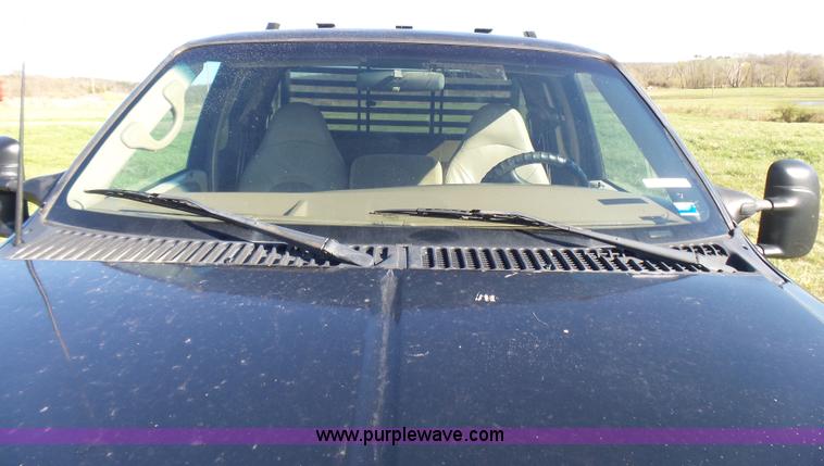 image for item BG9084 2000 Ford F250 Super Duty SuperCab flatbed pickup truck