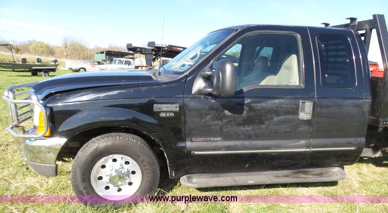 image for item BG9084 2000 Ford F250 Super Duty SuperCab flatbed pickup truck