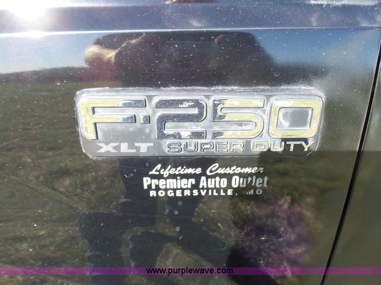 image for item BG9084 2000 Ford F250 Super Duty SuperCab flatbed pickup truck