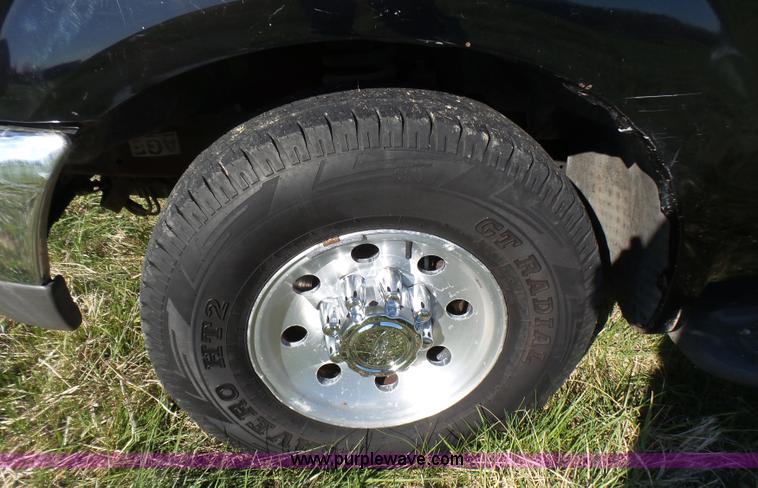 image for item BG9084 2000 Ford F250 Super Duty SuperCab flatbed pickup truck