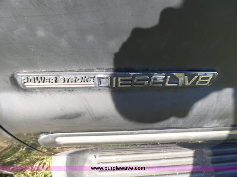 image for item BG9084 2000 Ford F250 Super Duty SuperCab flatbed pickup truck