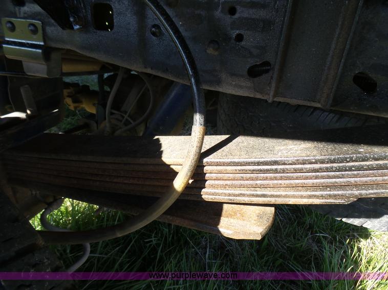 image for item BG9084 2000 Ford F250 Super Duty SuperCab flatbed pickup truck